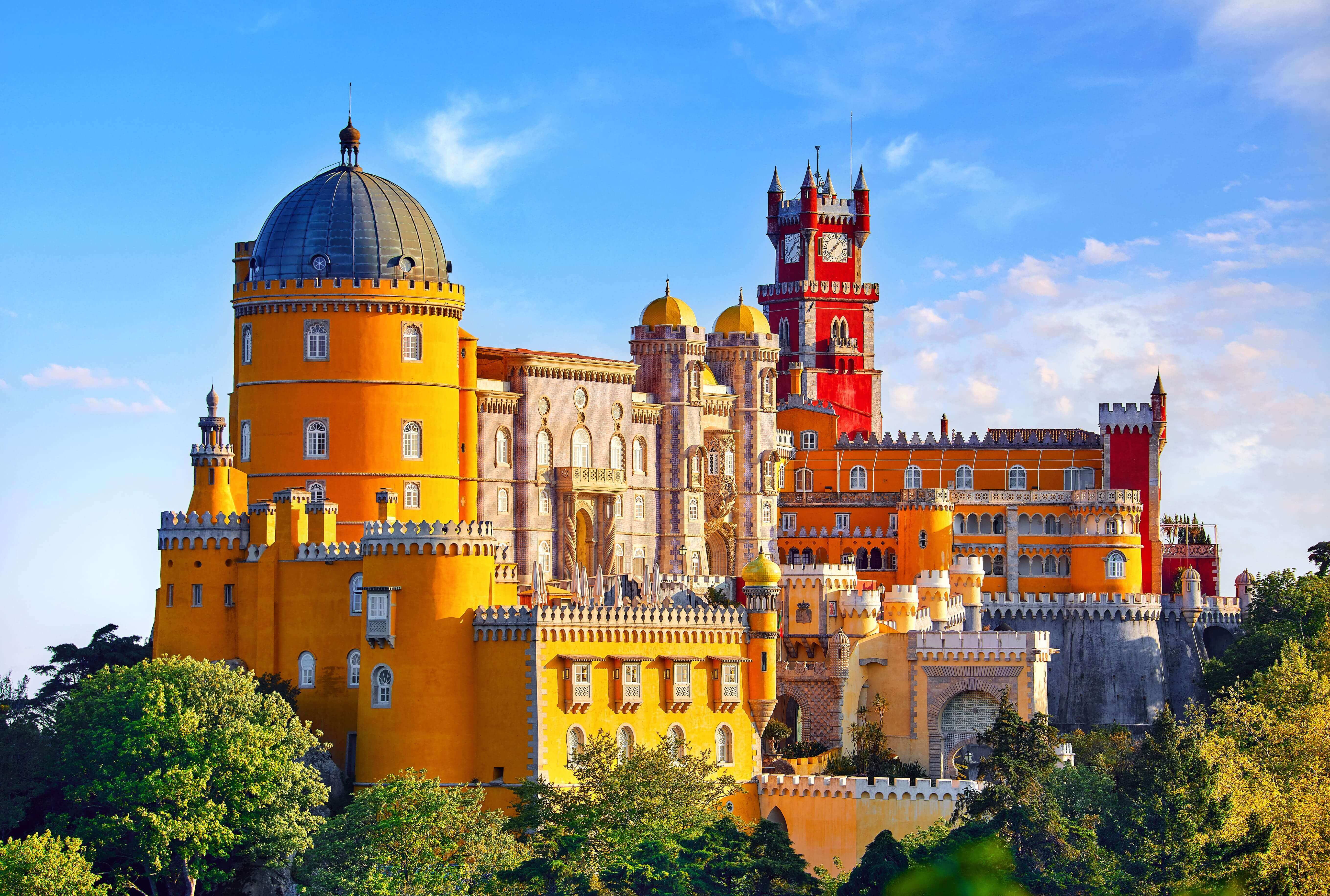 Palace of Pena in Sintra. Lisbon, Portugal. Famous landmark. Summer morning landscape with blue sky.